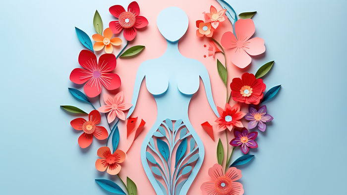 Silhouette einer Frau aus blauem Papier mit Blumen aus rotem und weißem Papier
